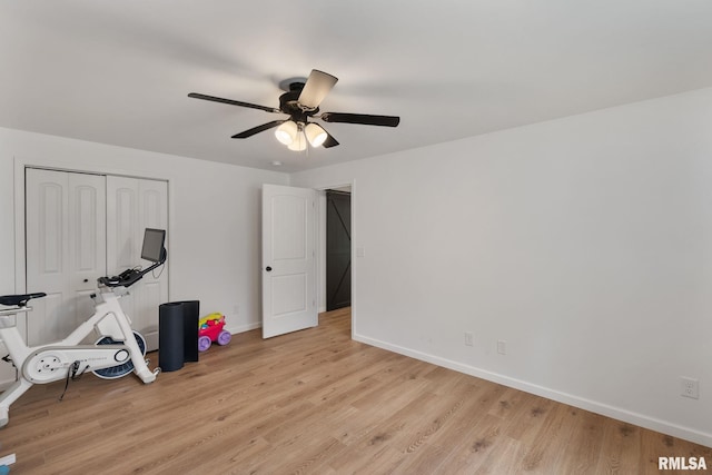 1625 W 71st St, Davenport, IA 52806 - exercise room featuring light wood-type flooring, baseboards, and a ceiling fan