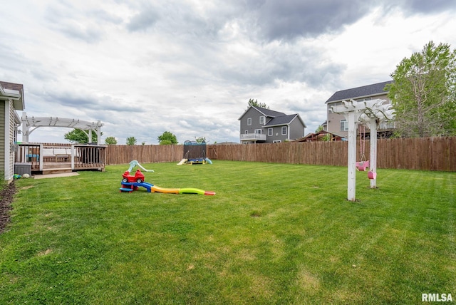 1625 W 71st St, Davenport, IA 52806 - view of yard featuring a pergola, a playground, and a wooden deck