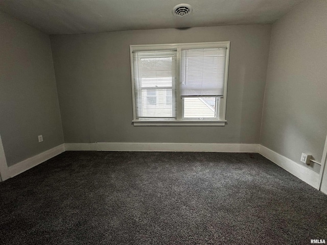 2107 N Marquette St, Davenport, IA 52804 - unfurnished room with dark carpet and baseboards
