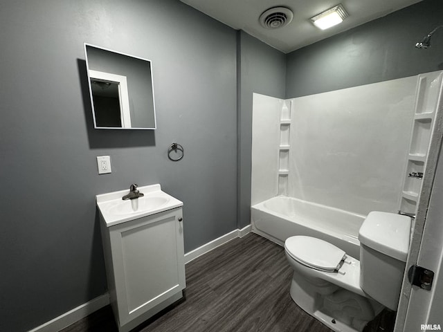 2107 N Marquette St, Davenport, IA 52804 - full bathroom featuring toilet, vanity, wood finished floors, baseboards, and shower / bath combination