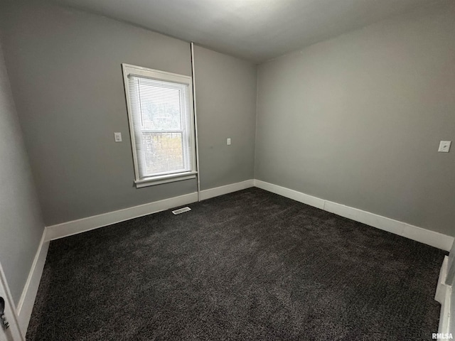 2107 N Marquette St, Davenport, IA 52804 - unfurnished room featuring dark carpet and baseboards