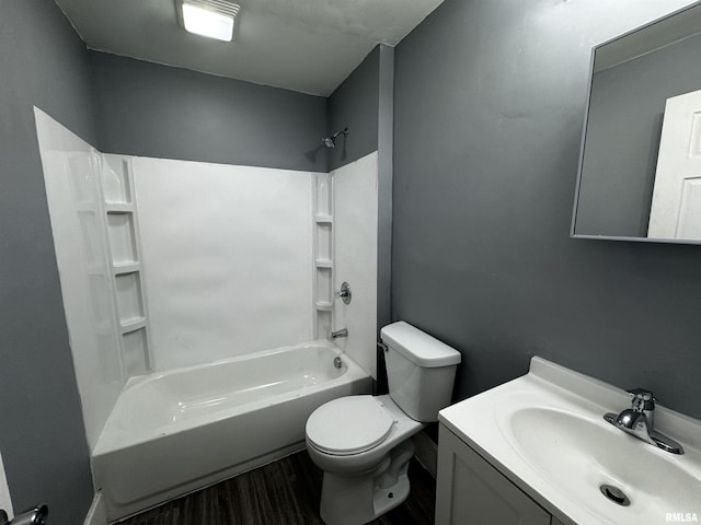 2107 N Marquette St, Davenport, IA 52804 - full bathroom featuring wood finished floors, toilet, bathtub / shower combination, and vanity