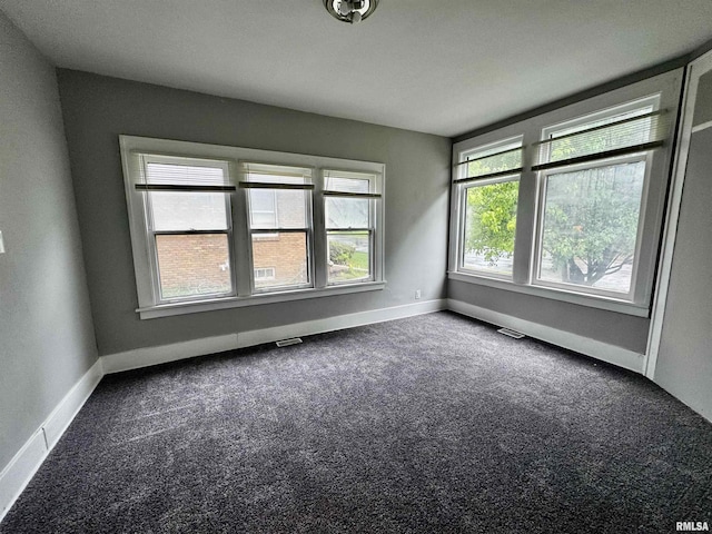 2107 N Marquette St, Davenport, IA 52804 - carpeted spare room featuring baseboards