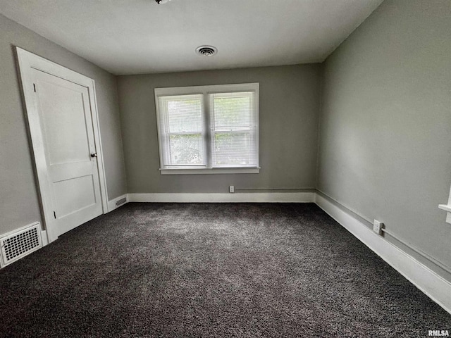 2107 N Marquette St, Davenport, IA 52804 - unfurnished room with dark carpet and baseboards