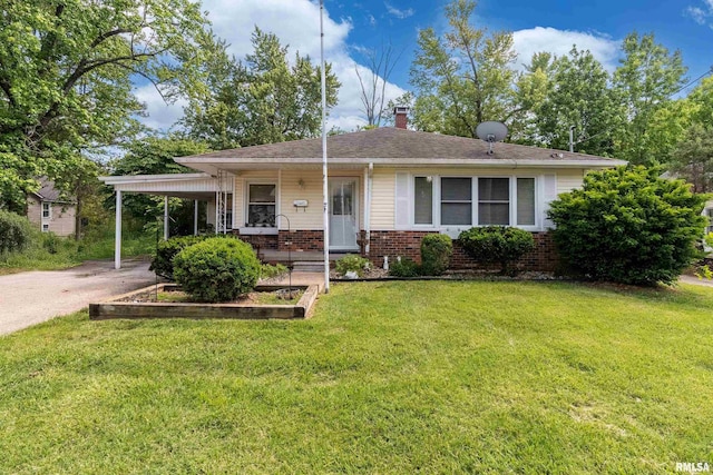 615 W Grand Ave, Carterville, IL 62918 - view of front of property featuring brick siding, a chimney, a front lawn, concrete driveway, and an attached carport