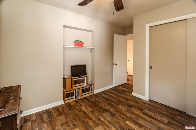 615 W Grand Ave, Carterville, IL 62918 - unfurnished living room featuring wood finished floors, a ceiling fan, and baseboards