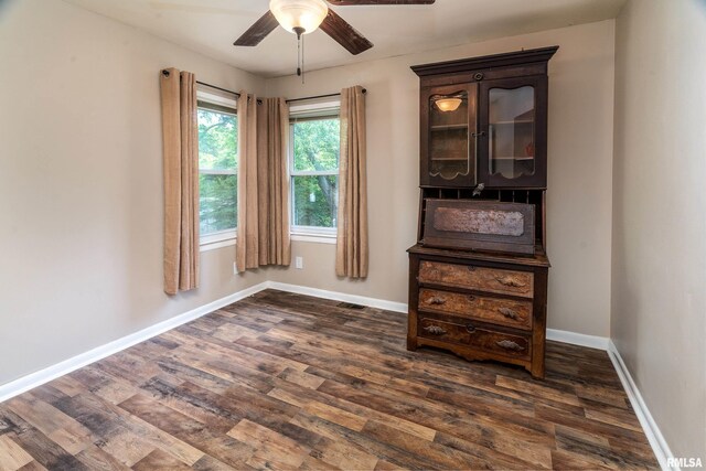 615 W Grand Ave, Carterville, IL 62918 - unfurnished dining area with ceiling fan, dark wood-type flooring, and baseboards