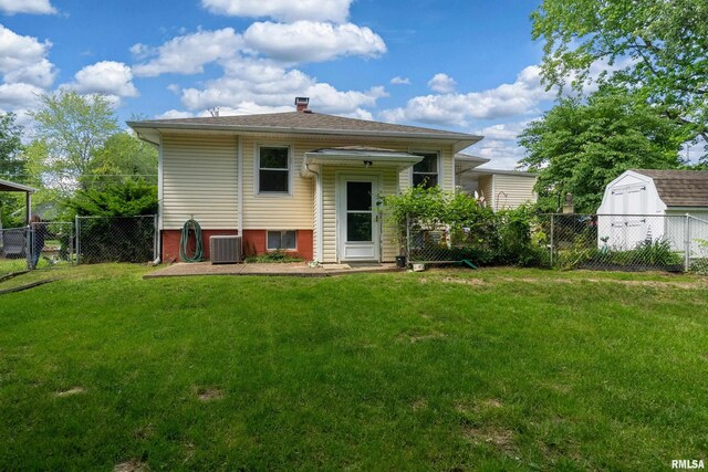 615 W Grand Ave, Carterville, IL 62918 - rear view of house with a chimney and central AC unit