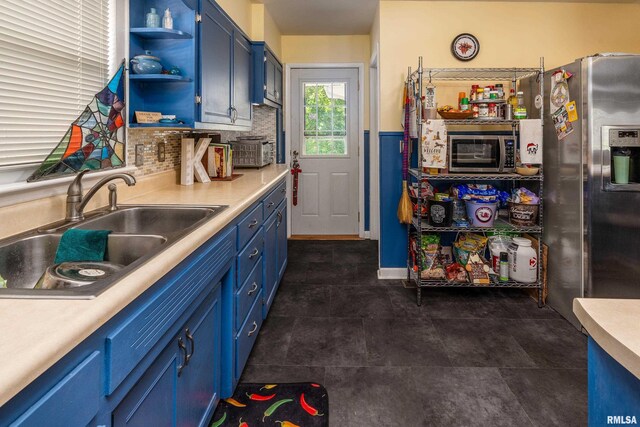 615 W Grand Ave, Carterville, IL 62918 - kitchen featuring blue cabinets, appliances with stainless steel finishes, a sink, open shelves, and light countertops