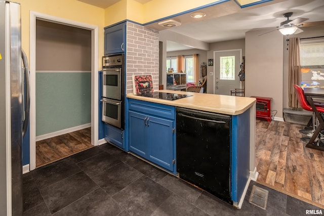 615 W Grand Ave, Carterville, IL 62918 - kitchen featuring blue cabinets, a peninsula, black appliances, light countertops, and a ceiling fan