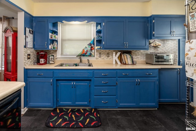 615 W Grand Ave, Carterville, IL 62918 - kitchen featuring blue cabinets, a sink, and light countertops