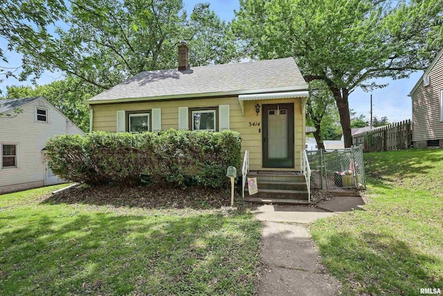 3414 Fillmore Ln, Davenport, IA 52806 - bungalow-style house featuring a chimney and a shingled roof