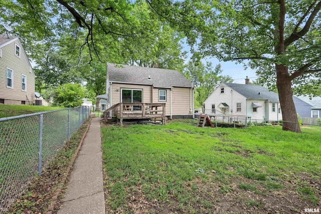 3414 Fillmore Ln, Davenport, IA 52806 - back of property featuring a wooden deck and a chimney