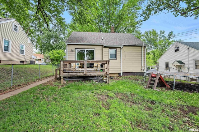 3414 Fillmore Ln, Davenport, IA 52806 - back of house featuring a wooden deck, a chimney, and a shingled roof