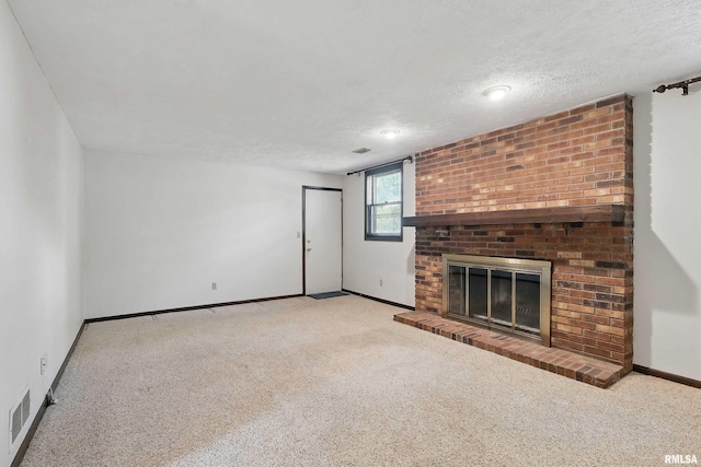 3845 Norwich Ct, Bettendorf, IA 52722 - unfurnished living room featuring carpet, baseboards, a fireplace, and a textured ceiling