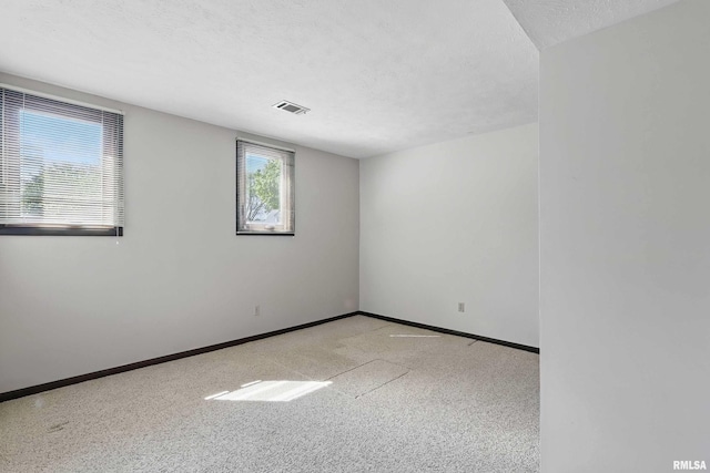 3845 Norwich Ct, Bettendorf, IA 52722 - unfurnished room featuring baseboards and a textured ceiling