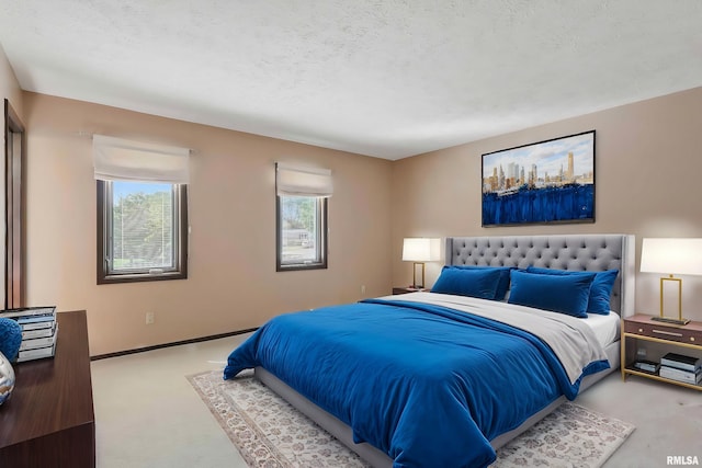 3845 Norwich Ct, Bettendorf, IA 52722 - carpeted bedroom with a textured ceiling