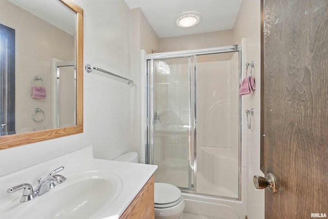 3845 Norwich Ct, Bettendorf, IA 52722 - full bathroom featuring toilet, a shower stall, and vanity