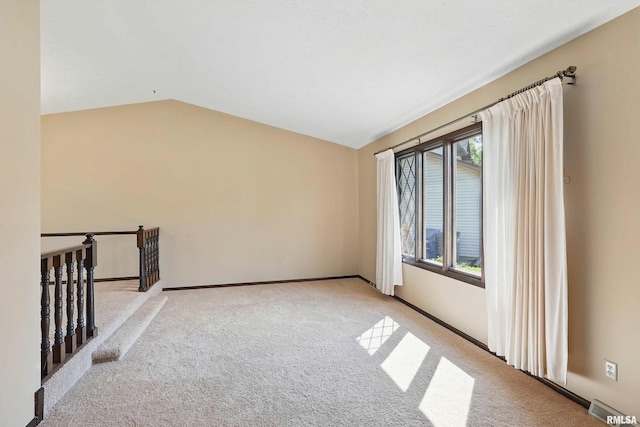 3845 Norwich Ct, Bettendorf, IA 52722 - carpeted spare room featuring vaulted ceiling and baseboards
