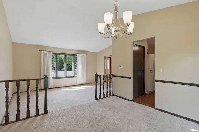 3845 Norwich Ct, Bettendorf, IA 52722 - spare room with carpet, vaulted ceiling, a chandelier, and baseboards