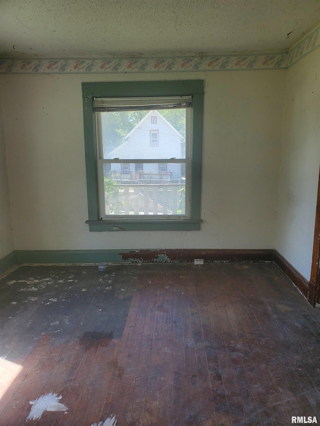 2208 E Locust St, Davenport, IA 52803 - empty room featuring hardwood / wood-style flooring and baseboards