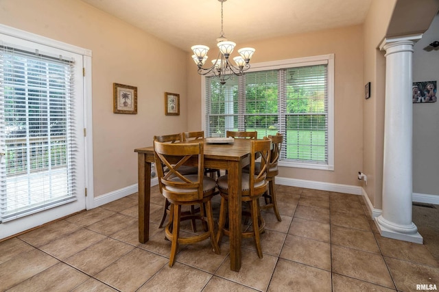 1404 Belle Terre Ct, Herrin, IL 62948 - dining room with decorative columns, a chandelier, light tile patterned floors, and baseboards