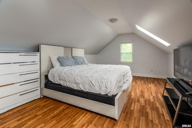 1404 Belle Terre Ct, Herrin, IL 62948 - bedroom with wood finished floors, a skylight, lofted ceiling, and baseboards