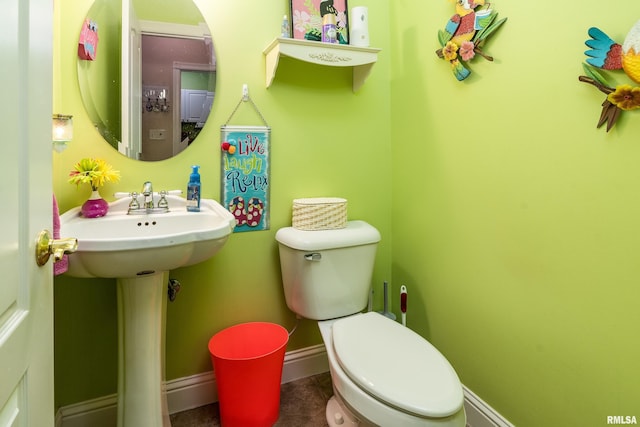1404 Belle Terre Ct, Herrin, IL 62948 - bathroom featuring toilet, baseboards, and tile patterned flooring