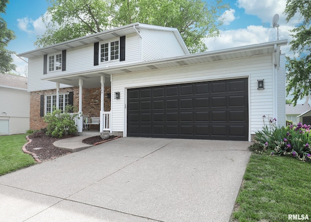 4760 Apple Valley Dr, Bettendorf, IA 52722 - traditional-style home with concrete driveway, an attached garage, brick siding, and a porch