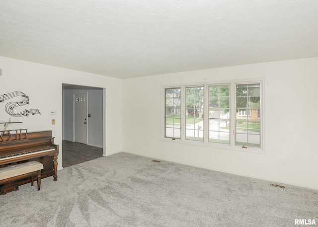 4760 Apple Valley Dr, Bettendorf, IA 52722 - carpeted empty room with a textured ceiling