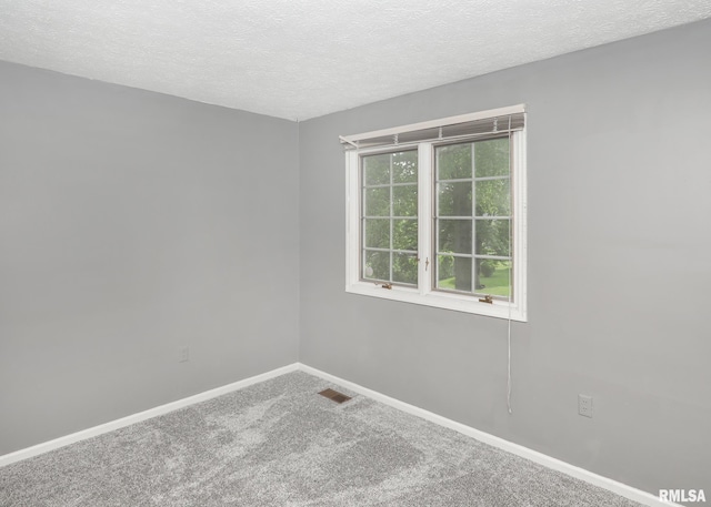 4760 Apple Valley Dr, Bettendorf, IA 52722 - empty room featuring carpet floors, a textured ceiling, and baseboards