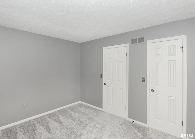 4760 Apple Valley Dr, Bettendorf, IA 52722 - unfurnished room featuring carpet, baseboards, and a textured ceiling