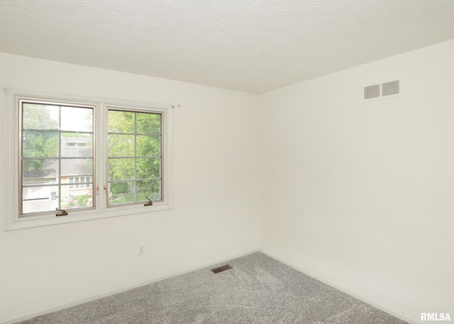 4760 Apple Valley Dr, Bettendorf, IA 52722 - unfurnished room with carpet flooring, baseboards, and a textured ceiling