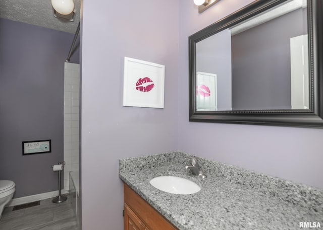 4760 Apple Valley Dr, Bettendorf, IA 52722 - bathroom with toilet, vanity, tile patterned flooring, baseboards, and shower / bath combination