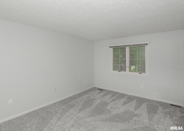 4760 Apple Valley Dr, Bettendorf, IA 52722 - carpeted spare room with a textured ceiling and baseboards