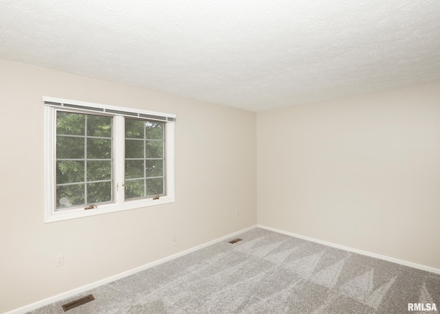 4760 Apple Valley Dr, Bettendorf, IA 52722 - empty room with carpet floors, a textured ceiling, and baseboards