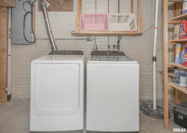 4760 Apple Valley Dr, Bettendorf, IA 52722 - washroom featuring separate washer and dryer and concrete block wall