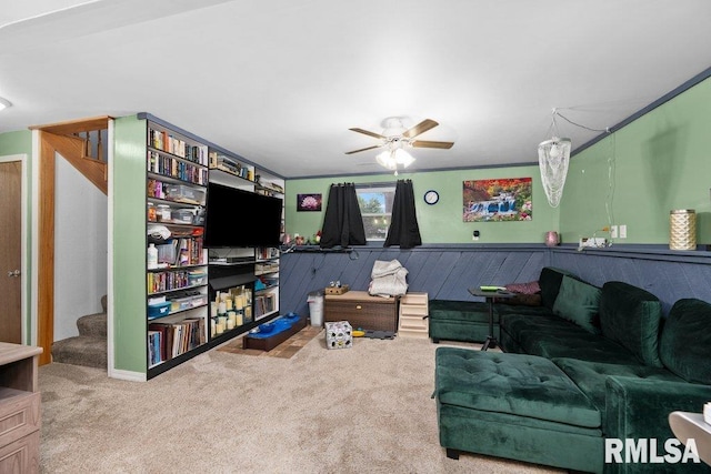 911 Cardinal Dr, Maquoketa, IA 52060 - carpeted living room featuring a ceiling fan and stairs