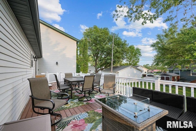 911 Cardinal Dr, Maquoketa, IA 52060 - deck featuring outdoor dining space