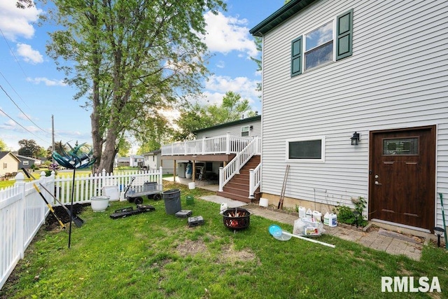 911 Cardinal Dr, Maquoketa, IA 52060 - view of yard with a wooden deck, a fire pit, and stairway
