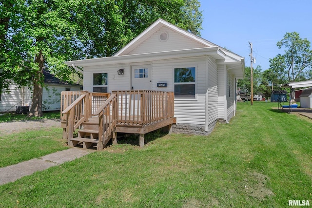 404 S 23rd St, Herrin, IL 62948 - view of front facade with a wooden deck and a front yard