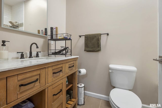 404 S 23rd St, Herrin, IL 62948 - bathroom featuring toilet, baseboards, tile patterned flooring, and vanity