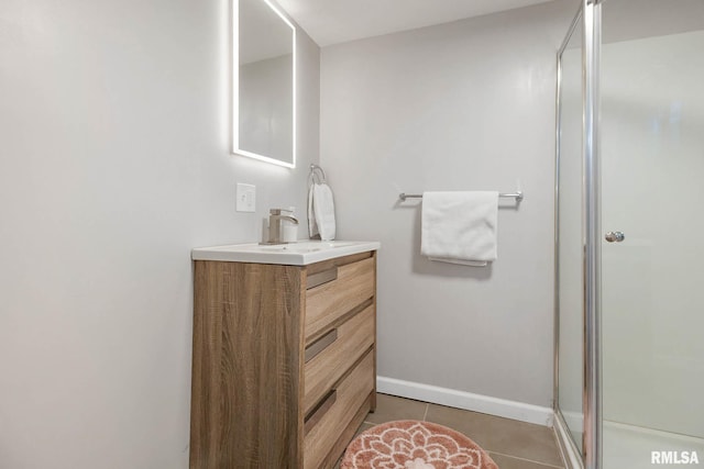 404 S 23rd St, Herrin, IL 62948 - bathroom featuring vanity, a shower stall, tile patterned floors, and baseboards