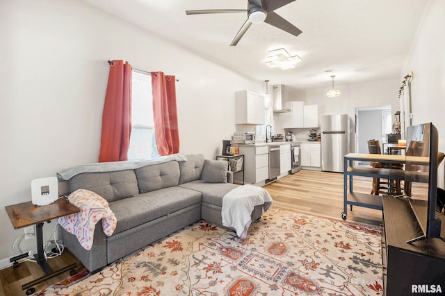 404 S 23rd St, Herrin, IL 62948 - living room featuring light wood finished floors and a ceiling fan