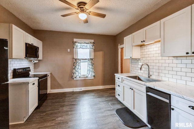 417 12th St, De Witt, IA 52742 - kitchen with black electric range oven, dishwasher, a sink, ceiling fan, and a textured ceiling