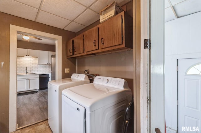 417 12th St, De Witt, IA 52742 - laundry room with cabinet space, separate washer and dryer, and ceiling fan