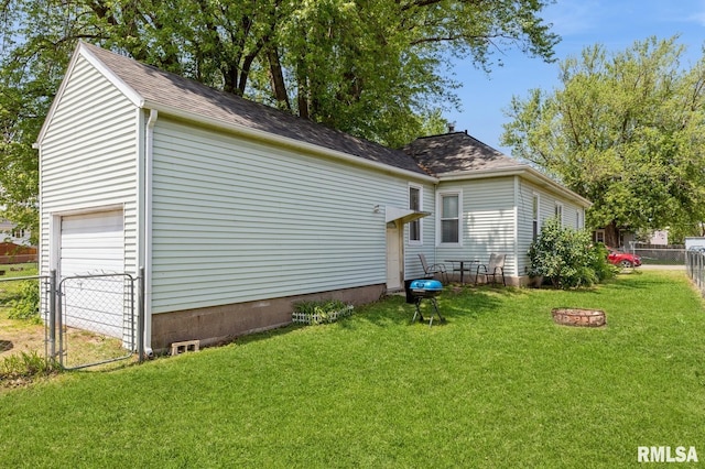 417 12th St, De Witt, IA 52742 - view of home's exterior with a garage and roof with shingles