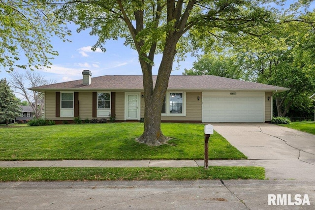 5647 Quercus Ln, Davenport, IA 52806 - single story home featuring an attached garage, driveway, a front lawn, and a chimney