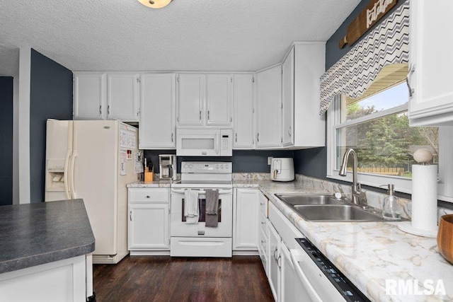 5647 Quercus Ln, Davenport, IA 52806 - kitchen with white appliances, a sink, white cabinets, dark wood-type flooring, and a textured ceiling