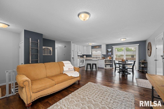 5647 Quercus Ln, Davenport, IA 52806 - living area with a textured ceiling and dark wood-style floors